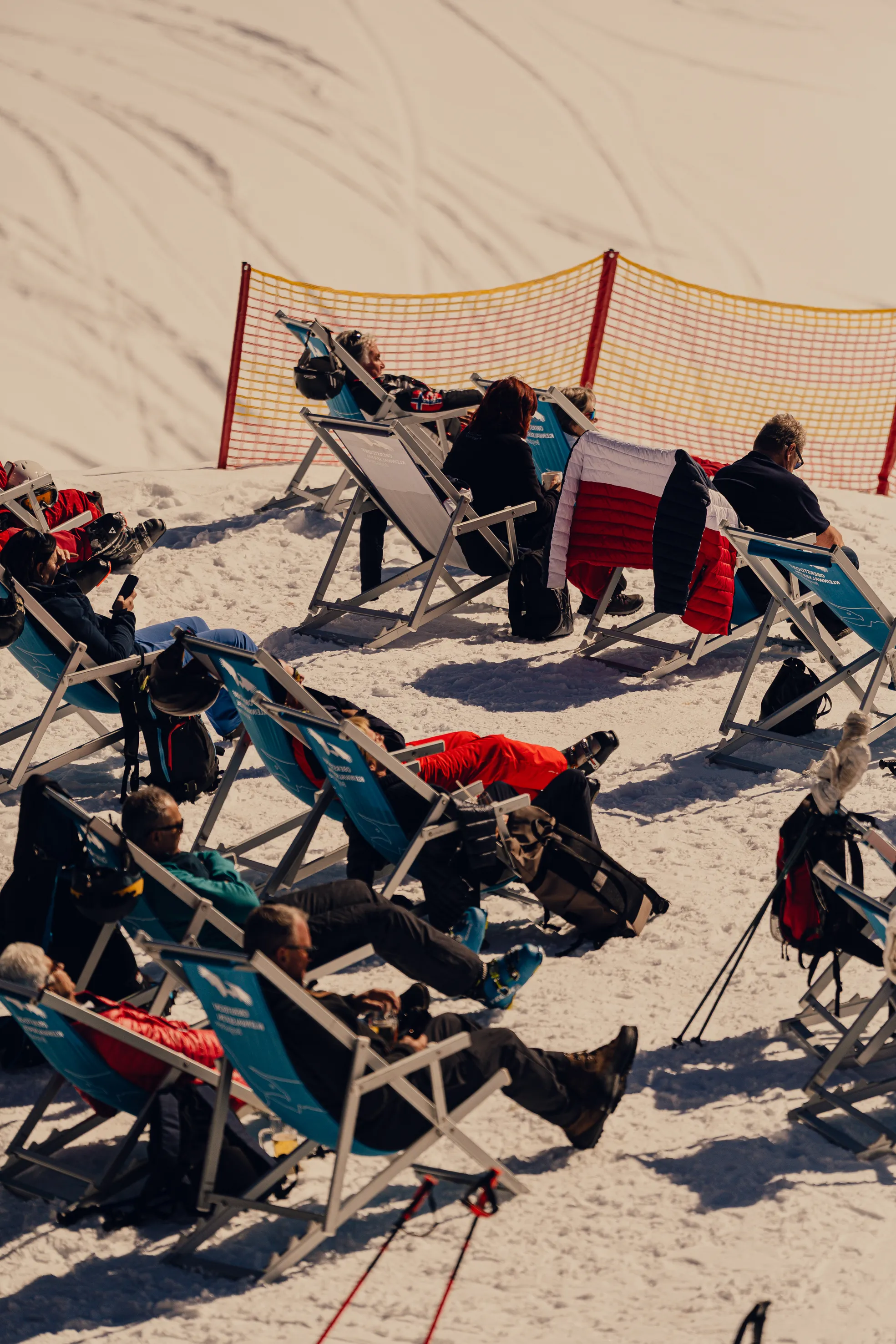 Guests relaxing in sun chairs at Haus Edelweiss